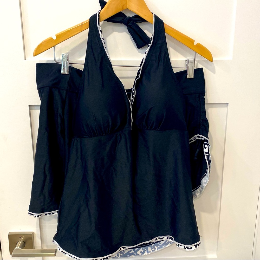 Brand new 2 pc bathing suit. Skort with Tankini. Black with white ruffle.